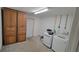 Functional laundry room features a washer, dryer, storage cabinets and ample space for sorting and folding at 8013 N Ola Ave, Tampa, FL 33604