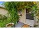Front door entrance with lush greenery and a birdbath at 1240 Chelsea Ln, Holiday, FL 34691