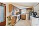 View of kitchen with wood cabinets and tiled floor at 1240 Chelsea Ln, Holiday, FL 34691