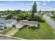 Aerial view of a single Gathering home, showcasing its curb appeal at 1240 Chelsea Ln, Holiday, FL 34691