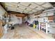 Garage offers shelving, storage, and space for a bicycle at 1240 Chelsea Ln, Holiday, FL 34691