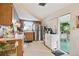 Kitchen boasts stainless steel appliances and access to a patio at 1240 Chelsea Ln, Holiday, FL 34691