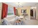 Bright dining area features a table, chairs, and a comfortable couch at 1240 Chelsea Ln, Holiday, FL 34691