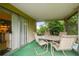 View of the screened porch from the kitchen at 1240 Chelsea Ln, Holiday, FL 34691