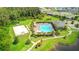 Aerial view of community pool, basketball court, and playground at 1181 Montgomery Bell Rd, Wesley Chapel, FL 33543