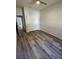 Bedroom with double door closet and wood-look floors at 2102 E North Bay St, Tampa, FL 33610