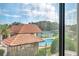 View of community pool, tennis courts, and gazebo from window at 2440 Winding Creek Blvd # 201, Clearwater, FL 33761