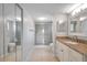 Updated bathroom with granite vanity and walk-in shower at 2440 Winding Creek Blvd # 201, Clearwater, FL 33761