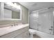 Bathroom with a shower/tub combo, granite vanity and updated fixtures at 2440 Winding Creek Blvd # 201, Clearwater, FL 33761