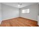 Spacious bedroom with hardwood floors and ceiling fan at 2440 Winding Creek Blvd # 201, Clearwater, FL 33761