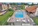 Community pool with patio furniture and hot tub at 2440 Winding Creek Blvd # 201, Clearwater, FL 33761