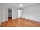 Hardwood floor bedroom with a large closet and ceiling fan at 2440 Winding Creek Blvd # 201, Clearwater, FL 33761