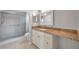 Bathroom features granite countertops, updated vanity and shower at 2440 Winding Creek Blvd # 201, Clearwater, FL 33761