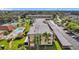 Aerial view of community showing building, pool, and parking at 2440 Winding Creek Blvd # 201, Clearwater, FL 33761