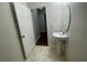 Small bathroom with single vanity and view of hallway at 3015 Winglewood Cir, Lutz, FL 33558