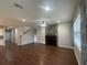 Spacious living room with hardwood floors and fireplace at 3015 Winglewood Cir, Lutz, FL 33558