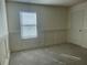 Bright bedroom with gray carpet and white wainscoting at 3015 Winglewood Cir, Lutz, FL 33558