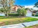 Two-story house with a two-car garage, manicured lawn and palm trees at 9083 Quail Creek Dr, Tampa, FL 33647