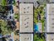 Aerial view of apartment complex with pool and surrounding landscape at 4611 W Fig St # 304, Tampa, FL 33609