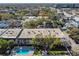 Apartment complex with pool and surrounding landscape, city view at 4611 W Fig St # 304, Tampa, FL 33609