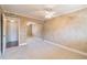 Well-lit bedroom with mirrored closet doors and neutral carpeting at 4611 W Fig St # 304, Tampa, FL 33609