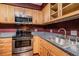 Galley kitchen with stainless steel appliances at 4611 W Fig St # 304, Tampa, FL 33609