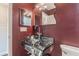 Clean bathroom with glass vessel sink and dark walls at 4611 W Fig St # 304, Tampa, FL 33609