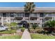 Condo building with entrance and landscaping at 4611 W Fig St # 304, Tampa, FL 33609