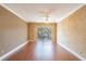 Living room with wood floors and sliding doors at 4611 W Fig St # 304, Tampa, FL 33609