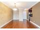 Bright dining area with hardwood floors and kitchen access at 4611 W Fig St # 304, Tampa, FL 33609