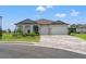 Two-story house with stone and siding, two car garage at 8514 Coastal Palms Gln, Parrish, FL 34219