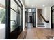 Light-filled entryway with black-framed doors and hardwood floors at 3305 W Beaumont St, Tampa, FL 33611