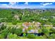 Aerial view of a waterfront property featuring a home with a pool and boat access at 14620 Coral Dr, Hudson, FL 34667