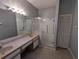 Bathroom boasts dual sinks and walk-in shower at 801 Manchester Woods Dr # 38, Sun City Center, FL 33573