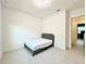 Spacious bedroom with double bed and en-suite access at 32676 Tree Of Life Ave, Wesley Chapel, FL 33543