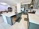 Modern kitchen with stainless steel appliances and island at 32676 Tree Of Life Ave, Wesley Chapel, FL 33543