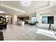 Open floor plan including kitchen, dining area, and living room with tile flooring at 32676 Tree Of Life Ave, Wesley Chapel, FL 33543