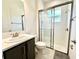 Modern bathroom with shower and single vanity at 32676 Tree Of Life Ave, Wesley Chapel, FL 33543