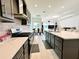 Modern kitchen with gray cabinets and island at 32676 Tree Of Life Ave, Wesley Chapel, FL 33543
