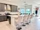 Modern kitchen with gray cabinets, white countertops, and island at 32676 Tree Of Life Ave, Wesley Chapel, FL 33543