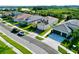 Aerial view of a residential street with houses and landscaping at 32676 Tree Of Life Ave, Wesley Chapel, FL 33543