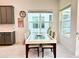 Dining area with glass-top table and six chairs at 32676 Tree Of Life Ave, Wesley Chapel, FL 33543