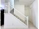 Modern white staircase with simple design at 32676 Tree Of Life Ave, Wesley Chapel, FL 33543