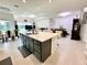 Modern kitchen with large island and stainless steel appliances at 32676 Tree Of Life Ave, Wesley Chapel, FL 33543