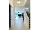 Bright and spacious entryway with tile floors and staircase at 32676 Tree Of Life Ave, Wesley Chapel, FL 33543