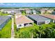 Aerial view of house with backyard patio and landscaping at 32676 Tree Of Life Ave, Wesley Chapel, FL 33543