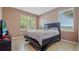 Bedroom with a bed, window, and tile floors at 18001 Richmond Place Dr # 1122, Tampa, FL 33647