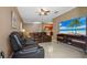 Spacious living area with large TV and comfortable seating at 18001 Richmond Place Dr # 1122, Tampa, FL 33647