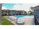 Community pool with lounge chairs and apartment buildings in background at 18001 Richmond Place Dr # 1122, Tampa, FL 33647