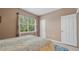 Bright bedroom with large window and neutral decor at 18001 Richmond Place Dr # 1122, Tampa, FL 33647